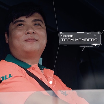 Toll employee looking up with the statistic 