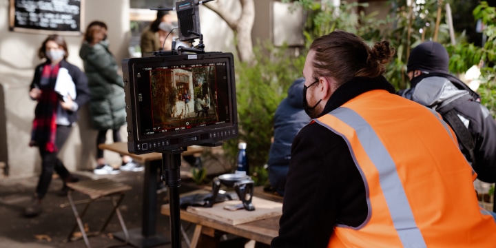 Shea checking footage on set at the Caleb & Brown shoot